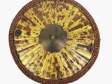 a picture of a decorative clock with a yellow and brown design