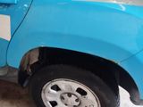 a blue truck with a white stripe on the side of it