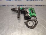 an electric drill is laying on a table with a cord
