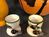 three vases sitting next to each other on a table