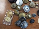 a lot of buttons and buttons on a table