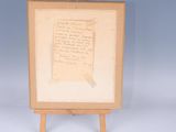 a wooden easel with a piece of paper on top of it