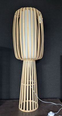 a lamp that is sitting on a table next to a speaker