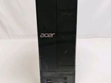 an acer desktop computer sitting on top of a white surface