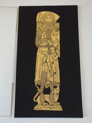 feuille d'or sur papier noir représentant la statue d'un homme tenant une épée