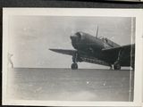 a black and white photo of a plane on the runway