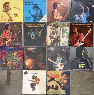 several different records are stacked on top of each other on the floor