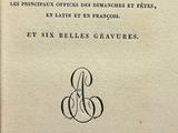 an old book with a black and white image of a woman ' s face