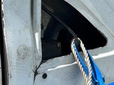 a rope hanging from the side of a truck door