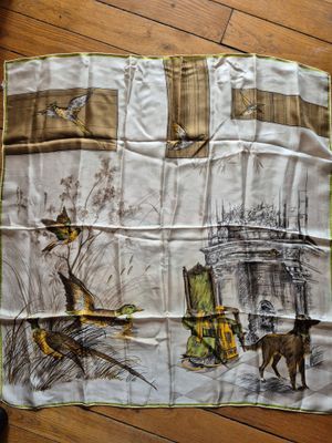 a scarf with a picture of a cat and a dog on it