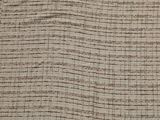 an image of a close up of a bed with a blanket on top of it