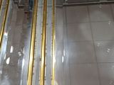 a glass display case with gold trimmings on it