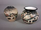 two vases sitting side by side on a table
