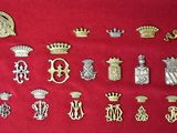 many different types of badges on a red surface