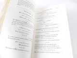 an open book that is sitting on a table