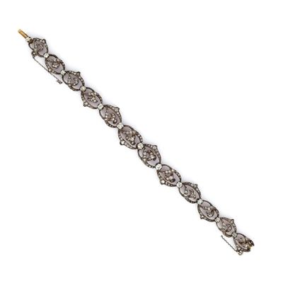 a close up of a diamond bracelet on a white background