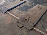 an image of a garage with a lot of tools on the floor