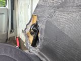 a bottle of beer in the back seat of a van