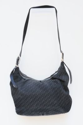 the bag is black and grey with a black handle and a black strap