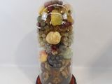 a picture of a glass jar filled with different kinds of rocks