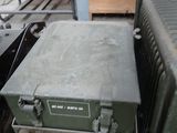 a green box sitting on top of a wooden pallet