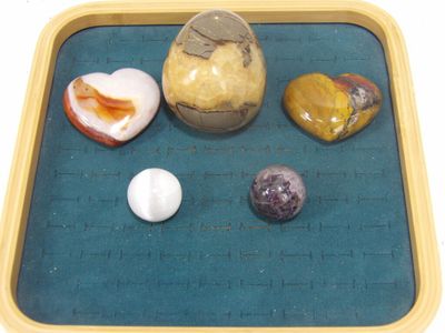 a tray that has rocks and eggs on it