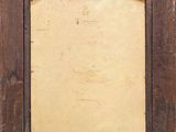 an old wooden picture frame with a brown background and writing on it