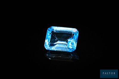 a blue topazte gems on a black background