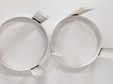 two cups that are sitting on a white surface