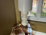 a lamp that is on top of a small table