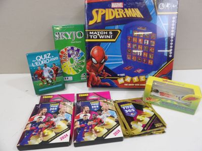 a spider - man board game and other games on the table