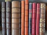 many books that are on a shelf in the room