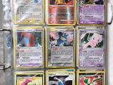 many different types of pokemon cards on display in a box
