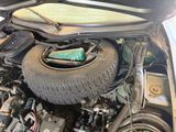 a car that has a tire in the trunk of it