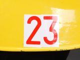 a yellow hard hat with the number 23 on it
