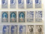 some old stamps are on display in a glass case