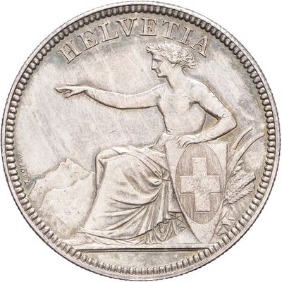 an old silver coin with a woman holding a cross on it