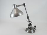 an image of a desk lamp that is on a table