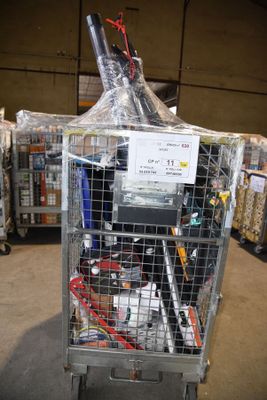 a metal cage with a computer on top of it in a warehouse