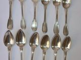 a lot of spoons that are sitting on a table