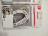 two white cables in the packaging on the table