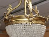 a chandelier hanging from the ceiling in a room