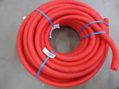 a close up of a red hose on a table