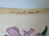 a drawing of a purple flower on the wall