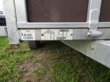 an image of a trailer that is parked in the grass