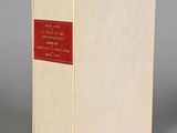 a white box with a red label sitting on top of a gray surface