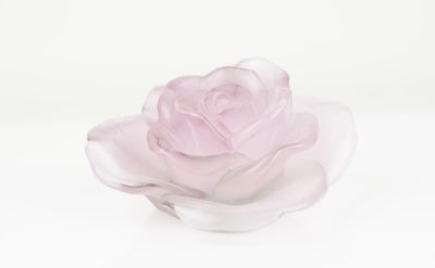 a glass rose that is sitting on a white surface