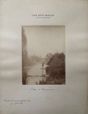 photograph of a black and white photo of a river and trees