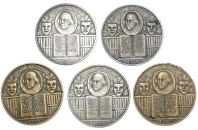 four different types of coins with faces on them on a white background