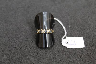 a close up of a ring on a table with a price tag
